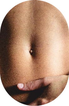Close-up of a person’s bare abdomen with a hand resting below the navel.
