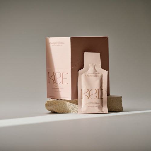 A KEE Liquid Marine Collagen Sachet - Mango Sorbet box and packet are shown on beige stone with a neutral background.